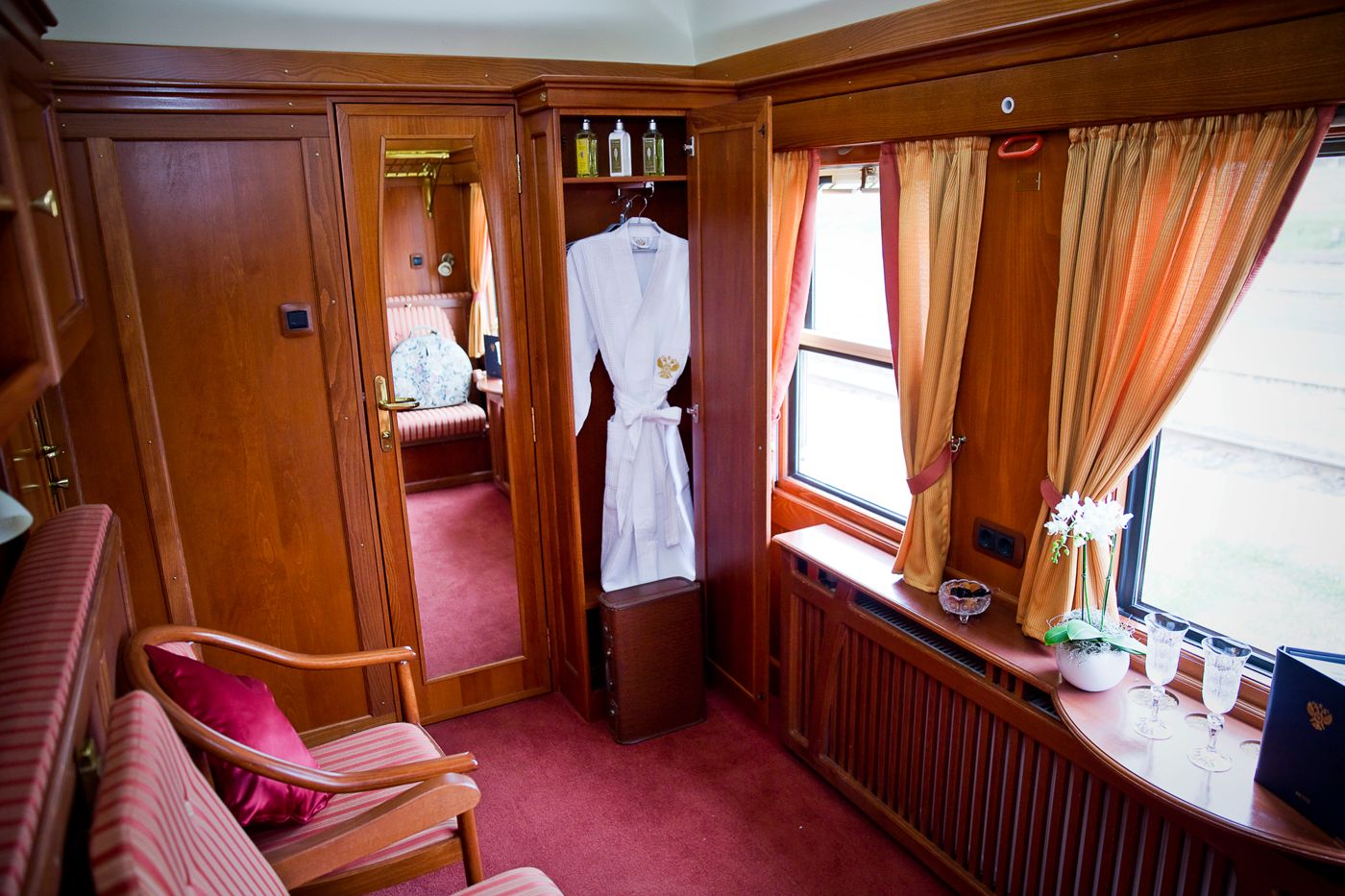 Deluxe cabin with armchairs and window