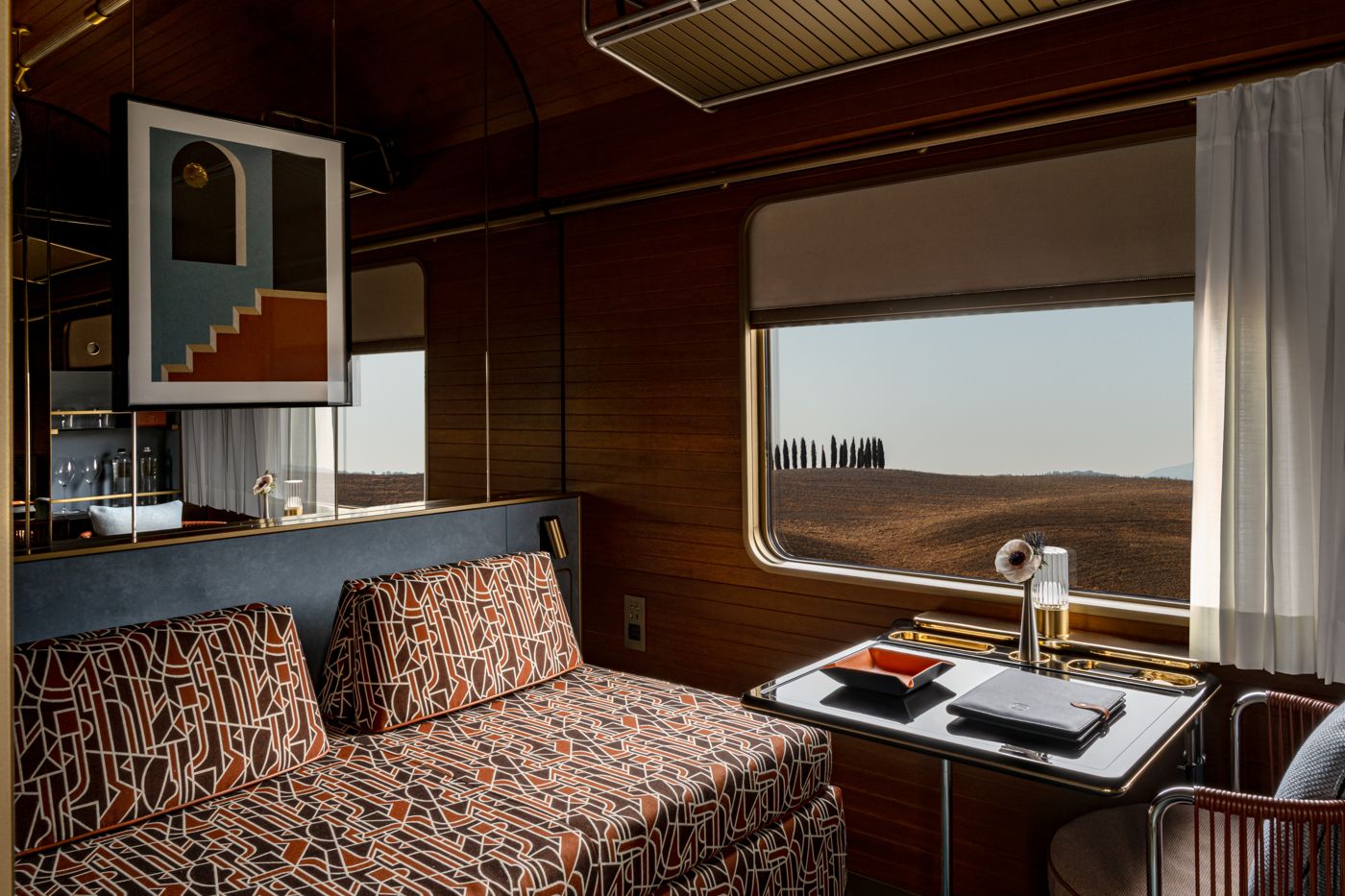 Deluxe Cabin by day with the sofa and window table