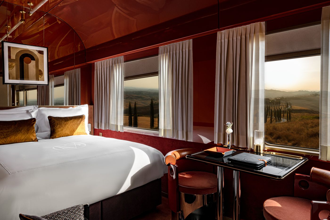 Suite bedroom with armchairs by the window