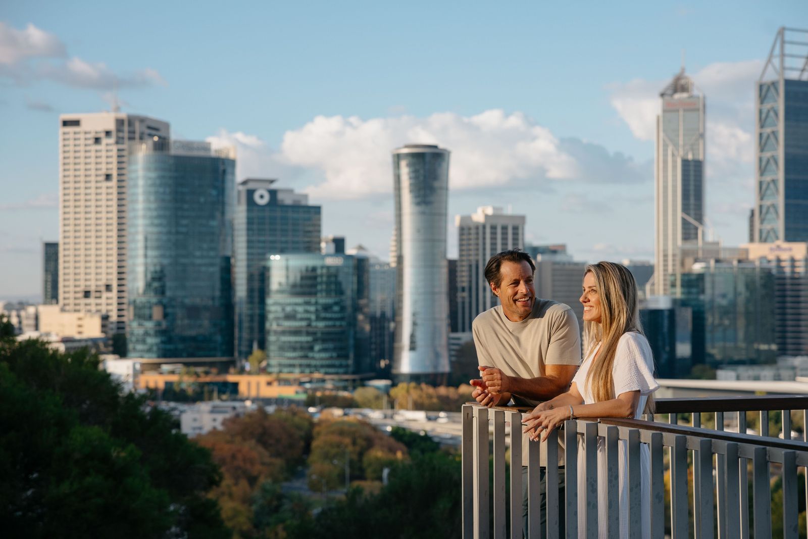 A couple at a Kings Park lookout with the Perth skyline behind. Photo: Tourism Australia