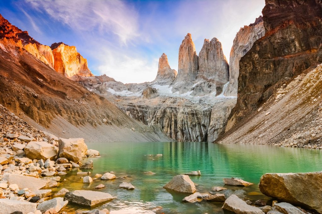 Scenic view of turquoise lake surrounded by mountains in Torres del Paine National Park, Chile.