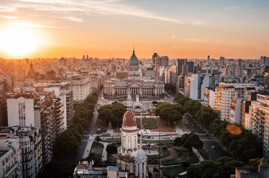 Aerial view of Buenos Aires, Argentina, featuring the Palace of Congress at sunset.