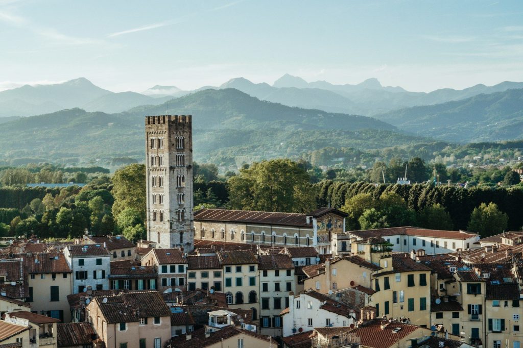 The rooftops of Lucca with hills beyond — Lucca, Italy