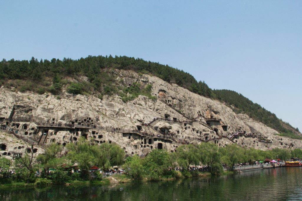 The Longmen Grottoes carved into the cliffs — Longmen Grottoes, Luoyang, China