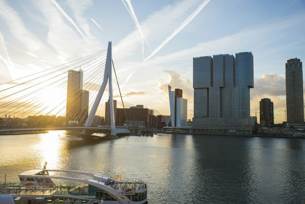 A ship passing the Erasmus Bridge in Rotterdam